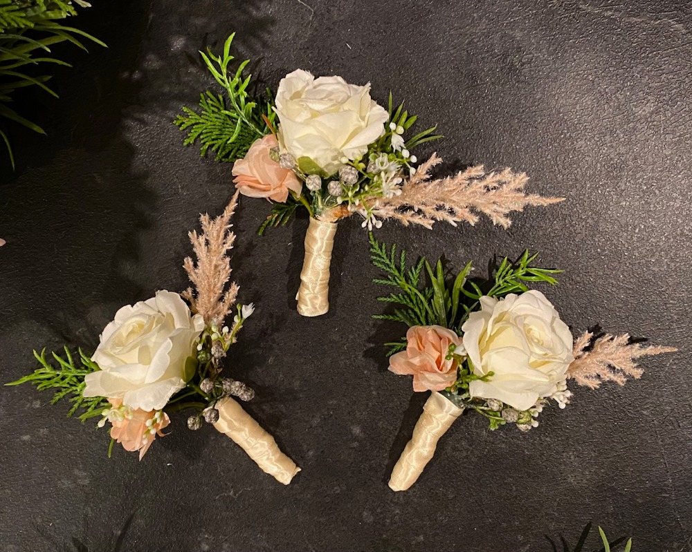 Buttonholes made by LeFay Faux Florals