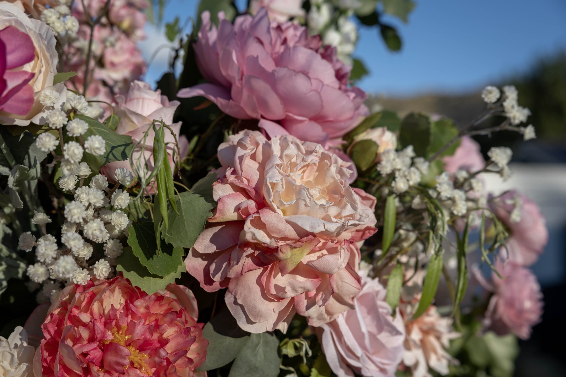 Close detail of faux peonies and roses